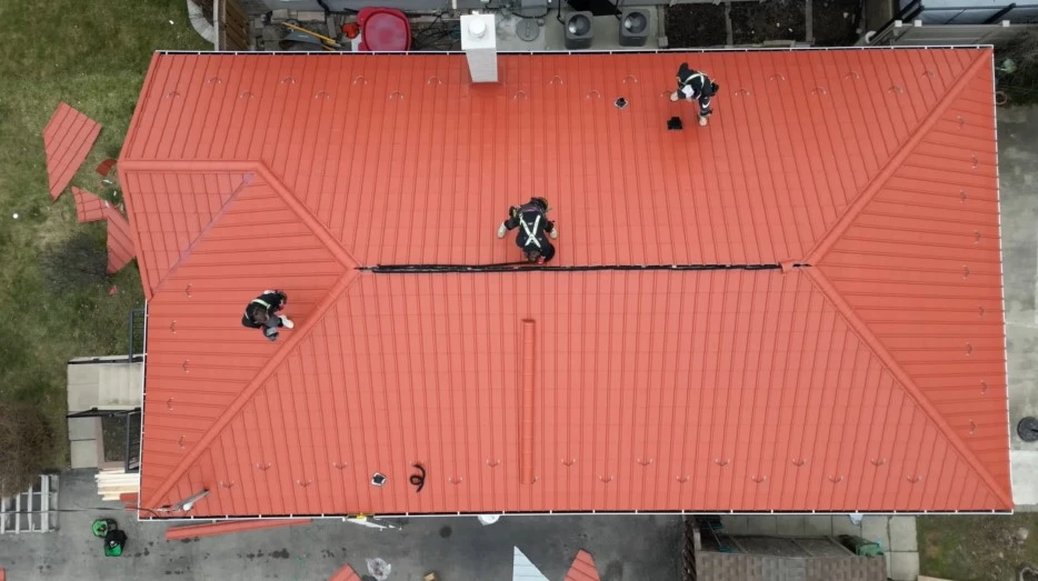 Aerial view of neighborhood getting new roofs